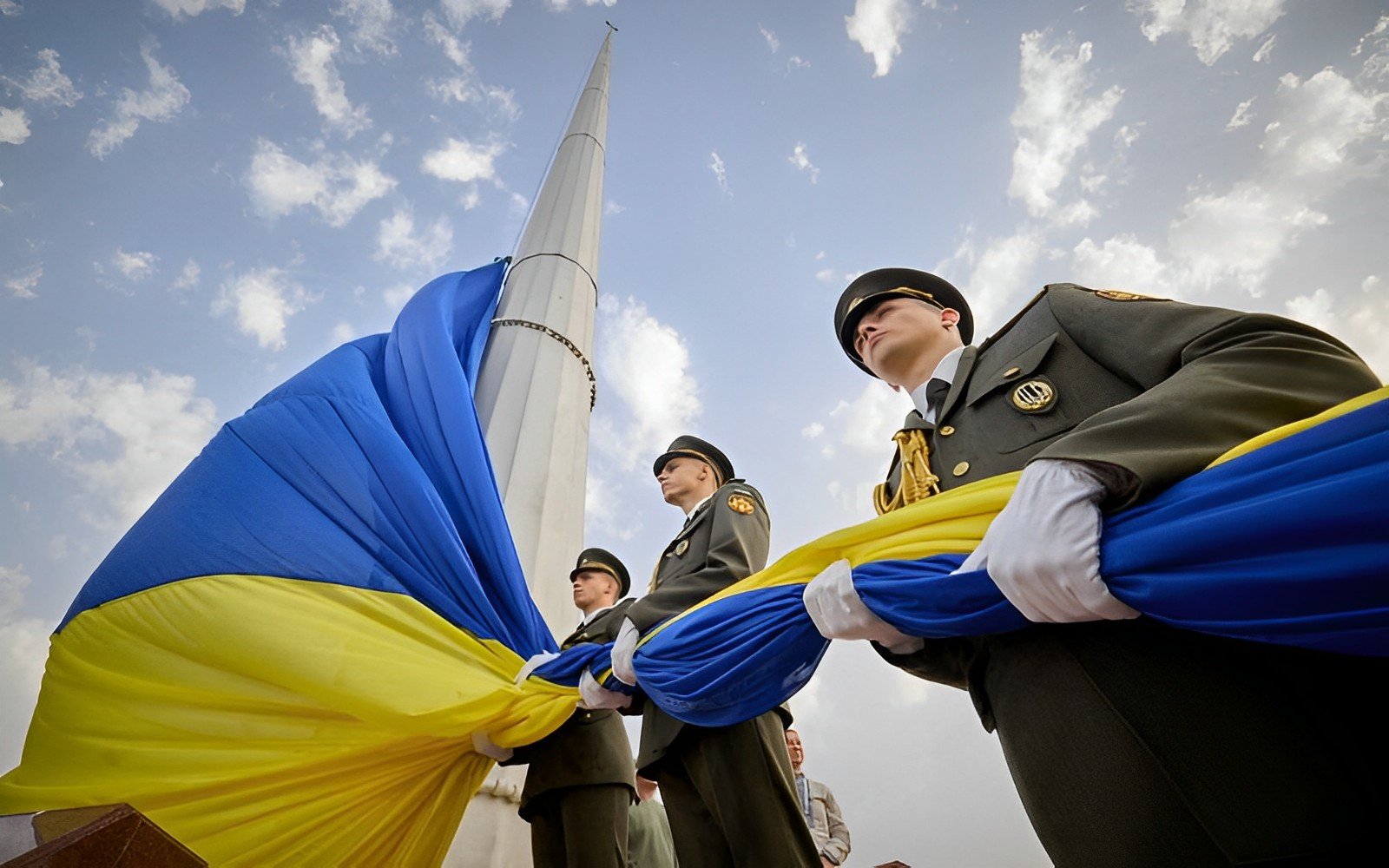 Members of the Honour Guard attend a rising ceremony of Ukraine's biggest national flag to mark the Day of the State Flag, amid Russia's attack on Ukraine, Photo Credit: Reuters