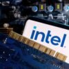 A smartphone with a displayed Intel logo is placed on a computer motherboard in this illustration taken March 6, 2023. REUTERS/Dado Ruvic/Illustration/
