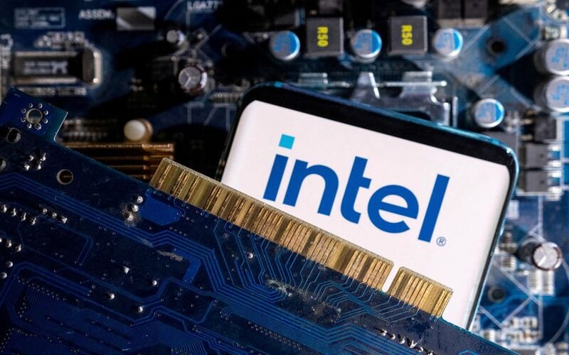 A smartphone with a displayed Intel logo is placed on a computer motherboard in this illustration taken March 6, 2023. REUTERS/Dado Ruvic/Illustration/