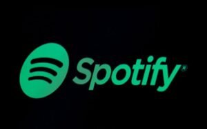 The Spotify logo is displayed on a screen on the floor of the New York Stock Exchange (NYSE) in New York, U.S.,