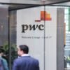 PwC logo is seen in the lobby of their offices in Barangaroo, Australia, June 22, 2023. REUTERS/Lewis Jackson/File Photo