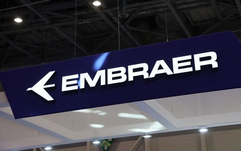 An Embraer logo is pictured during the European Business Aviation Convention & Exhibition (EBACE) in Geneva, Switzerland, May 23, 2022. REUTERS/Denis Balibouse/File Photo