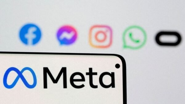 Facebook's new rebrand logo Meta is seen on smartphone in front of displayed logo of Facebook, Messenger, Instagram, WhatsApp and Oculus in this illustration picture taken October 28, 2021. REUTERS/Dado Ruvic/Illustration/File Photo