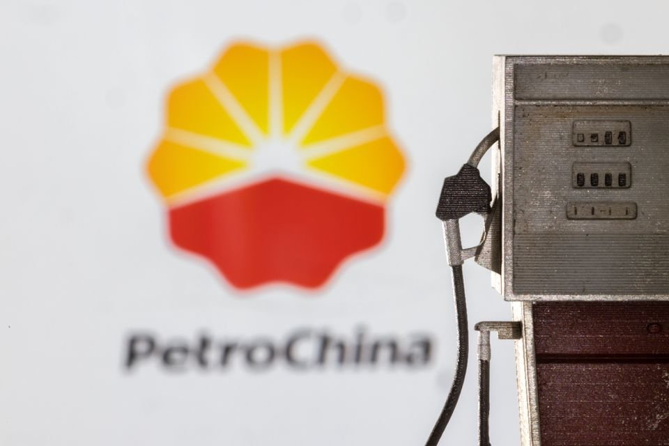 Model of petrol pump is seen in front of PetroChina logo in this illustration taken March 25, 2022. REUTERS/Dado Ruvic/Illustration