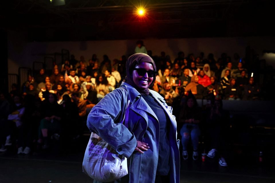 Actor Nadjma Abshir, 29 year old, performs a scene from the play ‘Desperate Times’, a sell-out comedy presentation by the Somali women's theatre company ‘Side eYe Productions’, at the Rich Mix arts centre in London, Britain, October 25, 2023. REUTERS/Hannah McKay/File Photo
