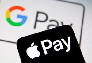 A smartphone with the Apple Pay logo is placed on a displayed Google Pay logo in this illustration taken on July 14, 2021. REUTERS/Dado Ruvic/Illustratio