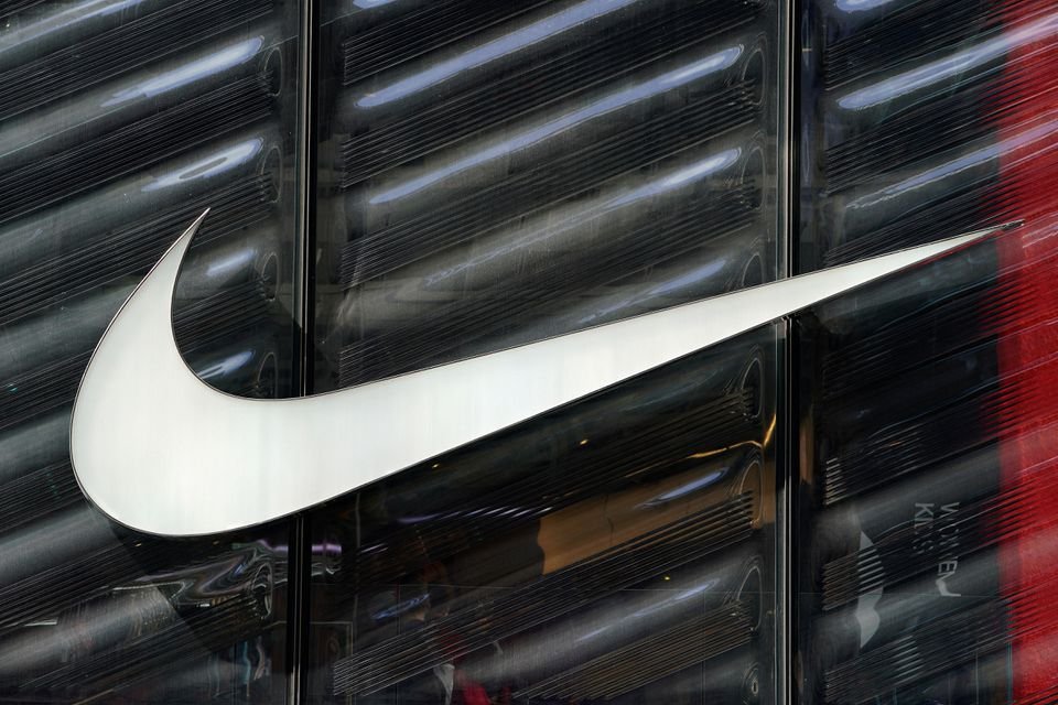 The Nike swoosh logo is seen outside the store on 5th Ave in New York, New York, U.S., March 19, 2019. REUTERS/Carlo Allegri/File Photo