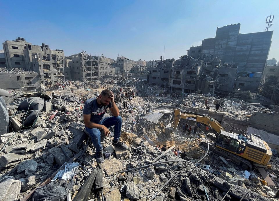 A man reacts as Palestinians search for casualties a day after Israeli strikes on houses in Jabalia refugee camp in the northern Gaza Strip, November 1, 2023. REUTERS/Mohammed Al-Masri