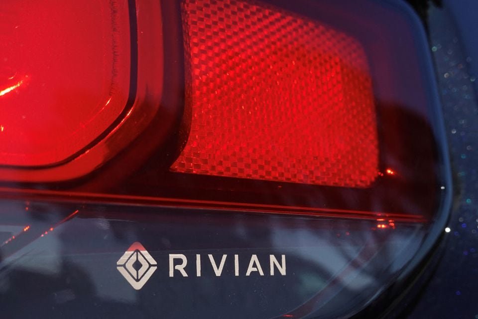 The Rivian name and logo are shown on one of their new electic SUV vehicles in California The Rivian name and logo are shown on one of their new electric SUV vehicles in San Diego, U.S., December 16, 2022. REUTERS/Mike Blake