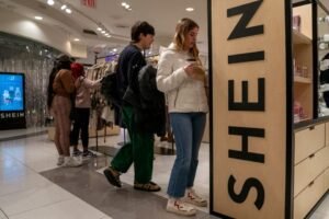 People shop at the Shein Holiday pop-up shop inside of Times Square's Forever 21 in New York City, U.S., November 10, 2023.REUTERS/David 'Dee' Delgado/File Photo