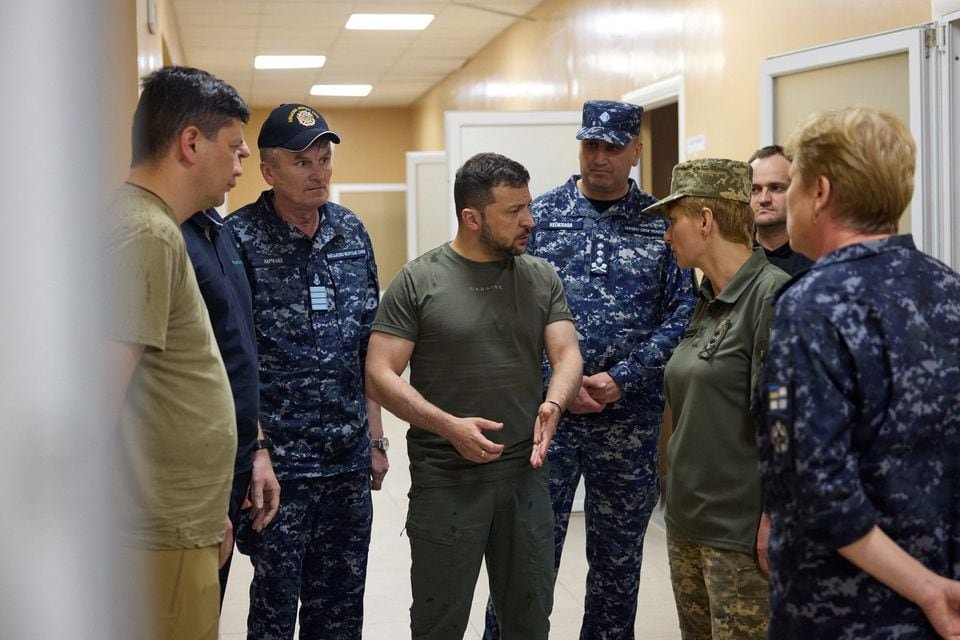 Ukraine's President Volodymyr Zelenskiy speaks with Commander of Medical Forces Major General Tetiana Ostashchenko as he visits a military hospital in the town of Ochakiv, amid Russia's attack on Ukraine, in Mykolaiv region, Ukraine July 27, 2023. Ukrainian Presidential Press Service/Handout via REUTERS/File Photo