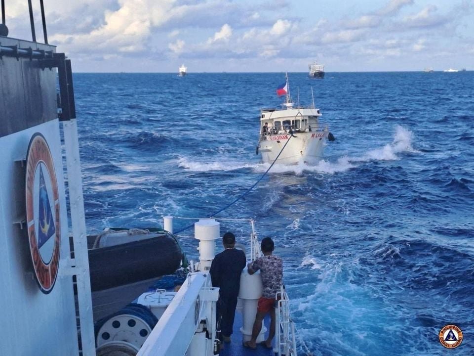 A Philippine Coast Guard ship tows a Filipino resupply vessel following damages due to water cannon from a Chinese Coast Guard ship as it was heading towards the disputed Second Thomas Shoal, in the South China Sea, December 10, 2023. Philippine Coast Guard/Handout via REUTERS/FILE PHOTO