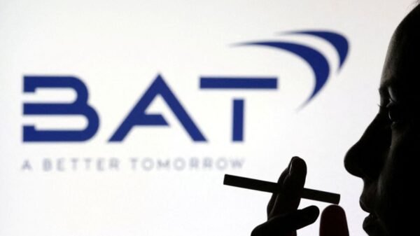 A woman poses with a cigarette in front of BAT (British American Tobacco) logo in this illustration taken July 26, 2022. REUTERS/Dado Ruvic/Illustration/File Photo