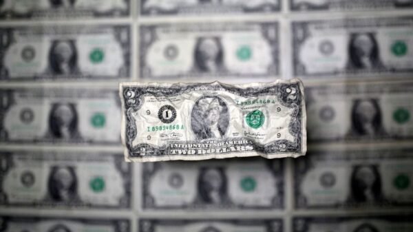 U.S. dollar banknote is seen in this picture illustration taken May 3, 2018. REUTERS/Dado Ruvic/Illustration/file photo