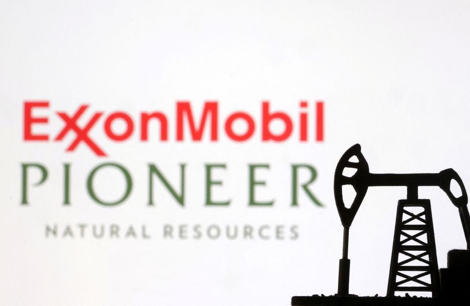 ExxonMobil and Pioneer Natural Resources logos are seen in this illustration taken, October 8, 2023. REUTERS/Dado Ruvic/Illustration/File Photo