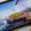 Game for Peace", Tencent's alternative to the blockbuster video game "PlayerUnknown's Battlegrounds" (PUBG) in China, is seen on a mobile phone in this illustration picture taken May 13, 2019. REUTERS/Florence Lo/Illustration/File Photo