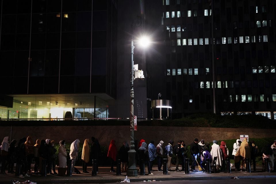 Immigrants wait in line outside the Federal Plaza Immigration Court in New York City, U.S., November 2, 2023. REUTERS/Shannon Stapleton/File Photo