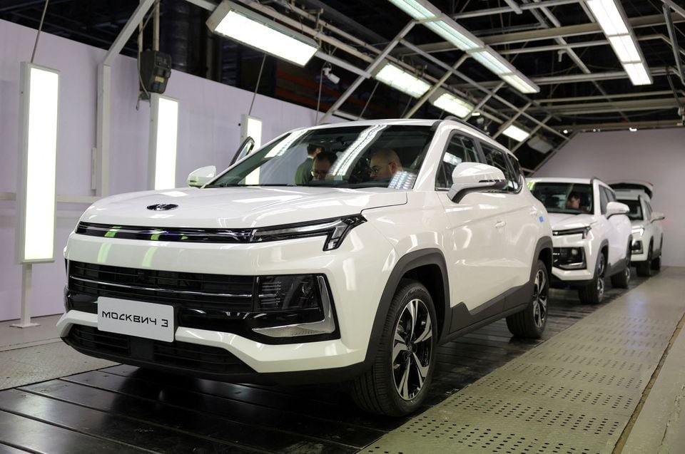 People sit inside cars on the assembly line of the Moskvich automobile factory in Moscow after production of vehicles under the Soviet-era brand was launched at French carmaker Renault's former plant in Moscow, Russia, November 23, 2022. REUTERS/Evgenia Novozhenina