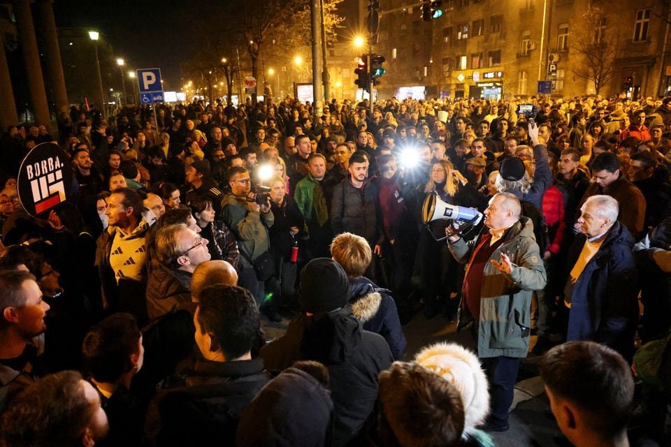 Srdjan Milivojevic, from the Democratic Party, speaks outside of Belgrade city police department, where some protesters were taken, during a protest after the 'Serbia Against Violence' (SPN) coalition alleged major election law violations in the Belgrade city and parliament races, in Belgrade, Serbia, December 25, 2023. REUTERS/Zorana Jevtic