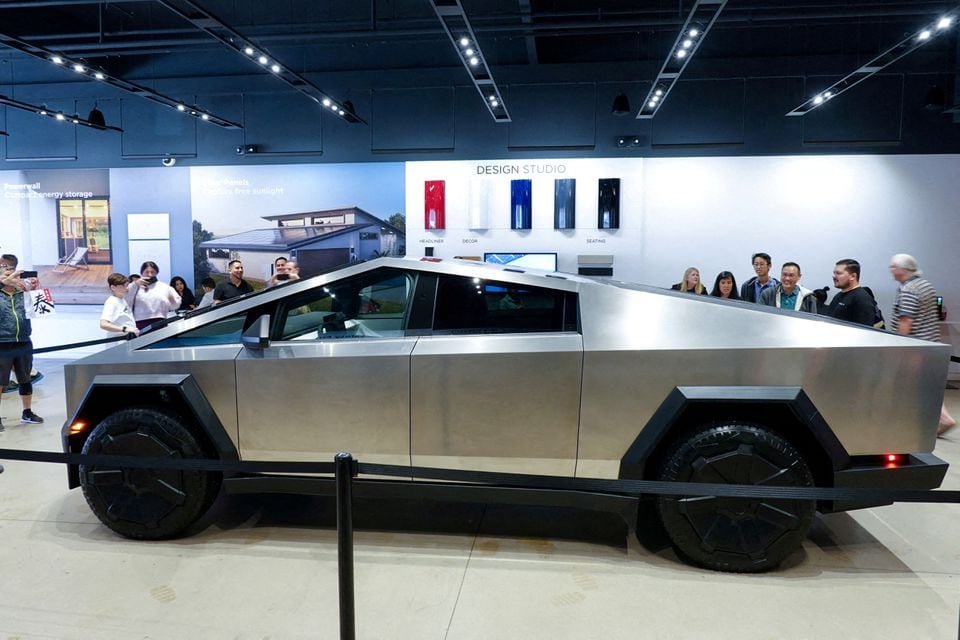 Tesla's new Cybertruck is shown on display at a Tesla store in San Diego, California, U.S., November 20, 2023. REUTERS/Mike Blake/File Photo