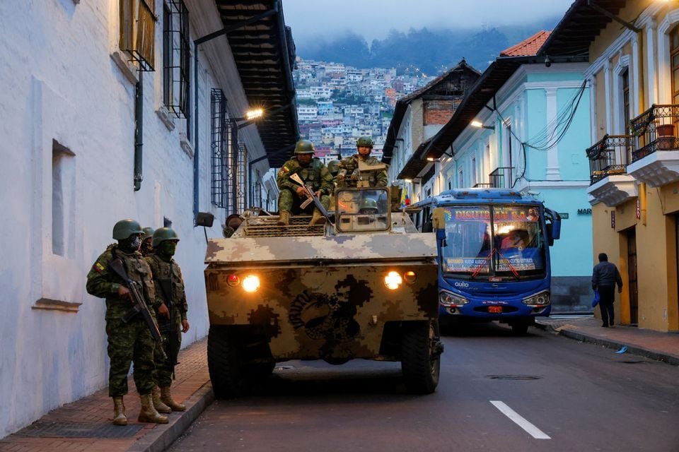 Soldiers in an armoured vehicle patrol the city's historic centre following an outbreak of violence a day after Ecuador's President Daniel Noboa declared a 60-day state of emergency following the disappearance of Adolfo Macias, leader of the Los Choneros criminal gang from the prison where he was serving a 34-year sentence, in Quito, Ecuador, January 9, 2024. REUTERS/Karen Toro